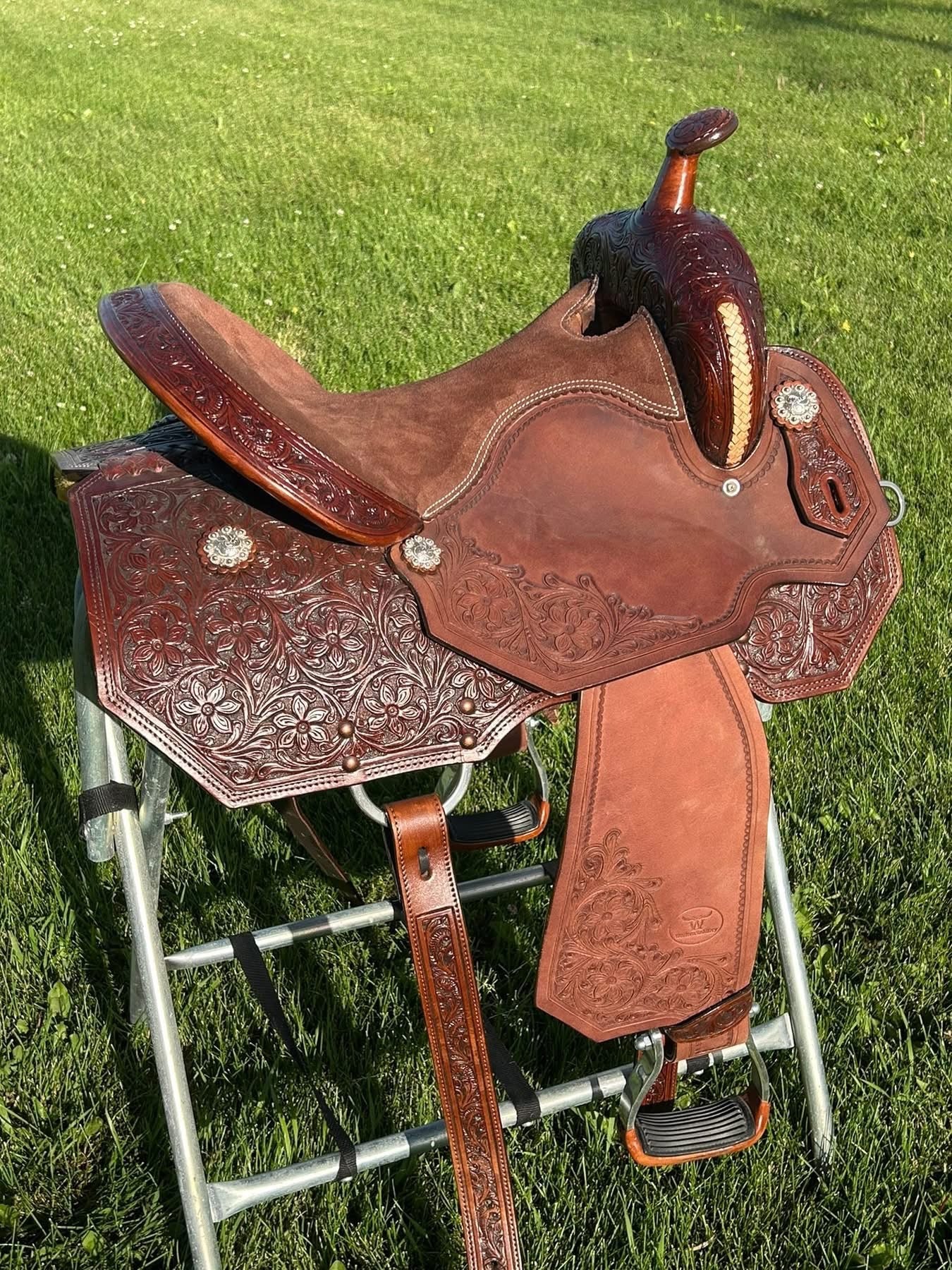 New 15” Western Saddlery floral tooled, braided rawhide, padded seat, 7” gullet