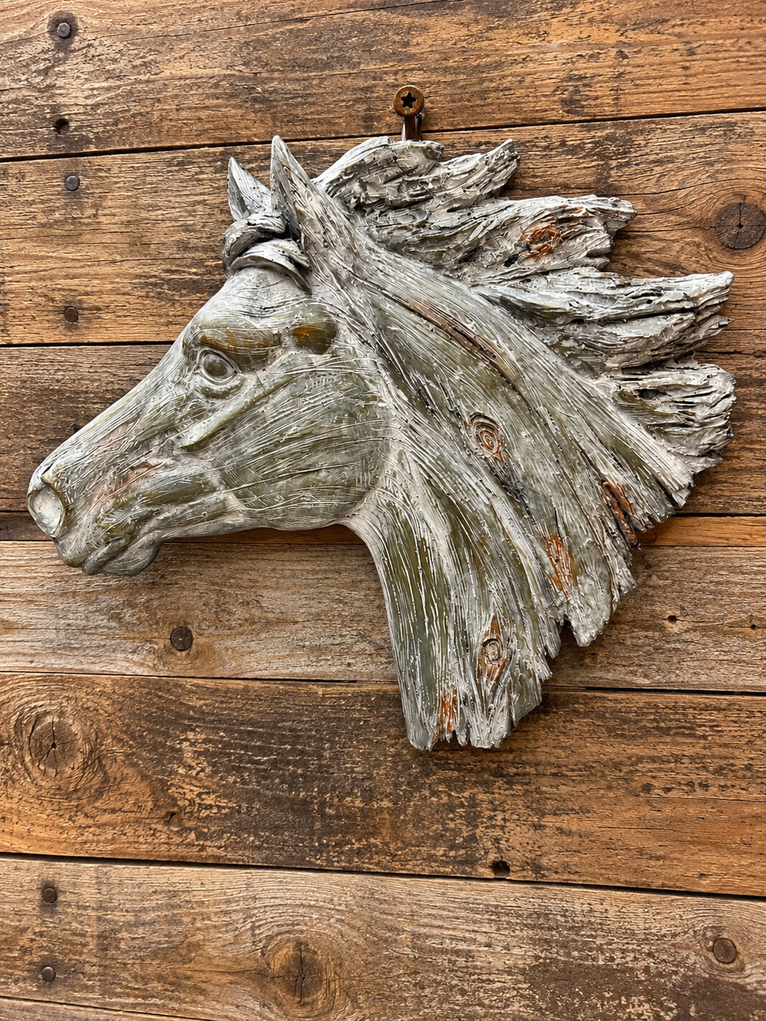 Beautiful horse head weathered wood look. Made of resin 12 1/4"L x 1 1/4"W x 10 1/2"H