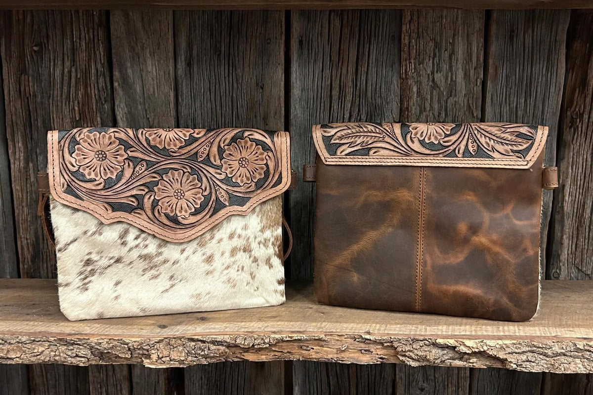 Leather purse with cowhide 9”L x 8”T adjustable shoulder strap included