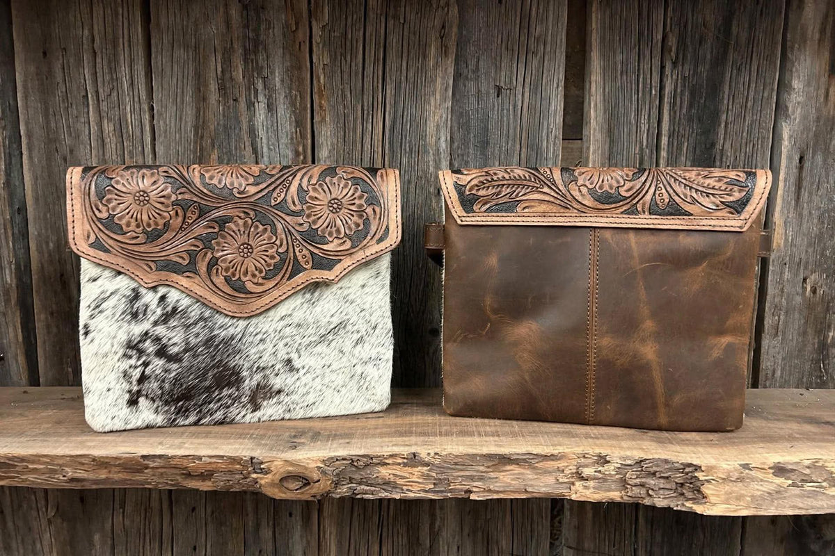Leather purse with cowhide 9”L x 8”T adjustable shoulder strap included