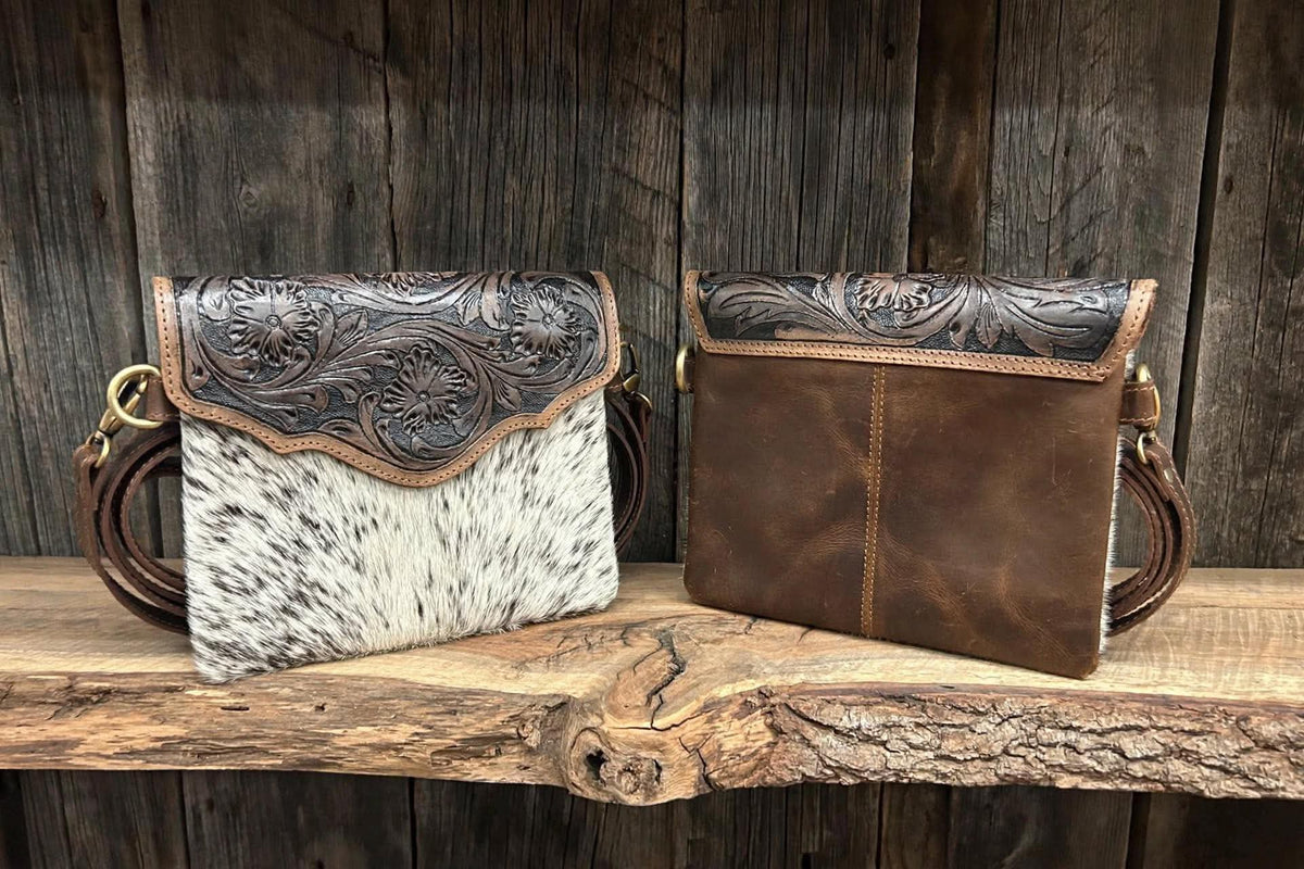 Leather purse with cowhide 9”L x 8”T adjustable shoulder strap included