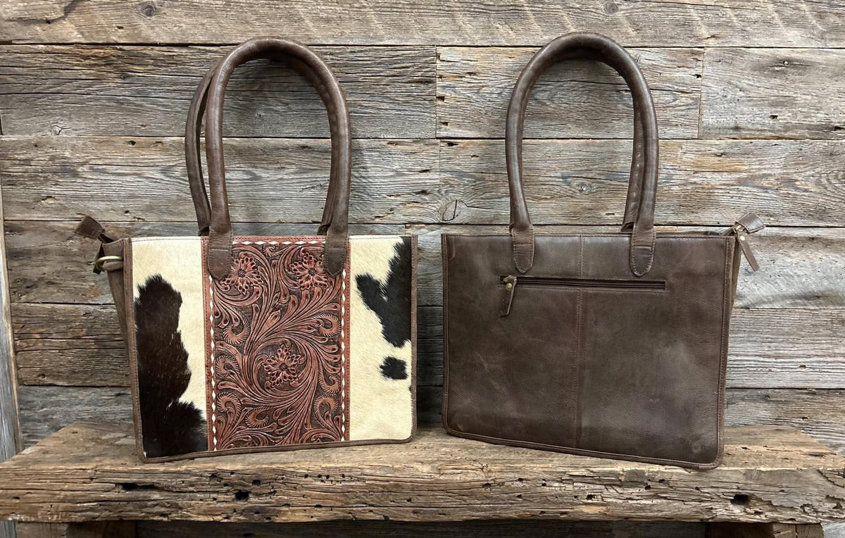 Leather purse with cowhide 14”L x 11”T x 3” W adjustable shoulder strap included