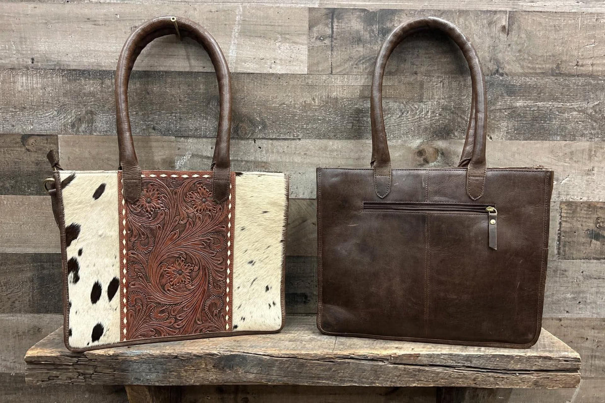 Leather purse with cowhide 14”L x 11”T x 3” W adjustable shoulder strap included