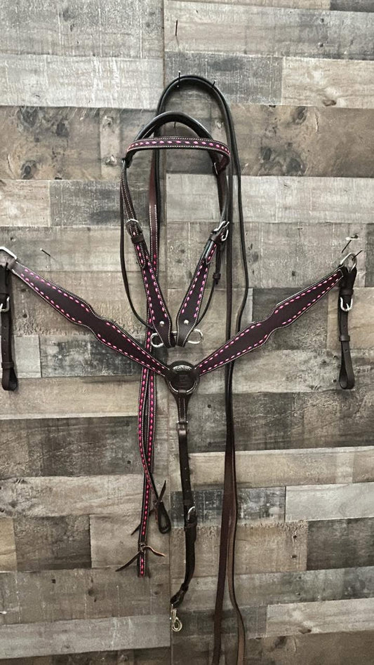 Hot oiled 3 piece set with pink buckstitch.Headstall, reins, breast collar.