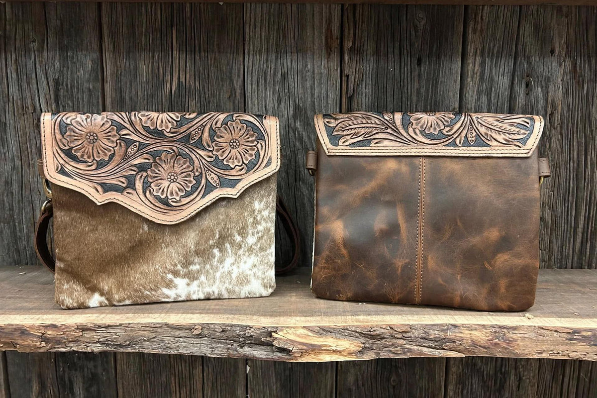 Leather purse with cowhide 9”L x 8”T adjustable shoulder strap included