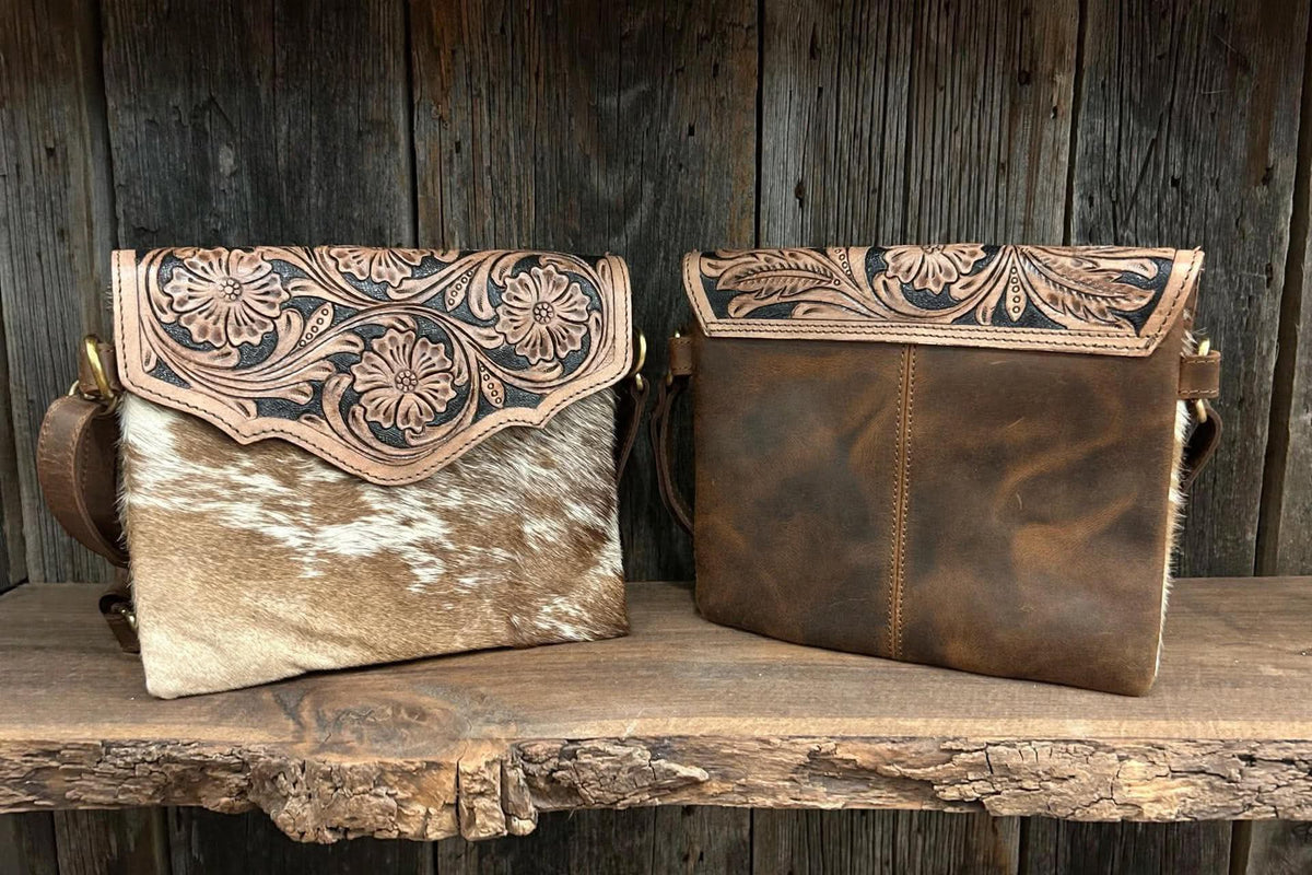 Leather purse with cowhide 9”L x 8”T adjustable shoulder strap included