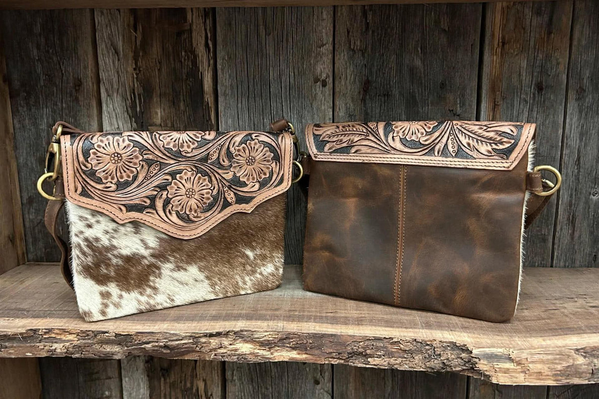 Leather purse with cowhide 9”L x 8”T adjustable shoulder strap included