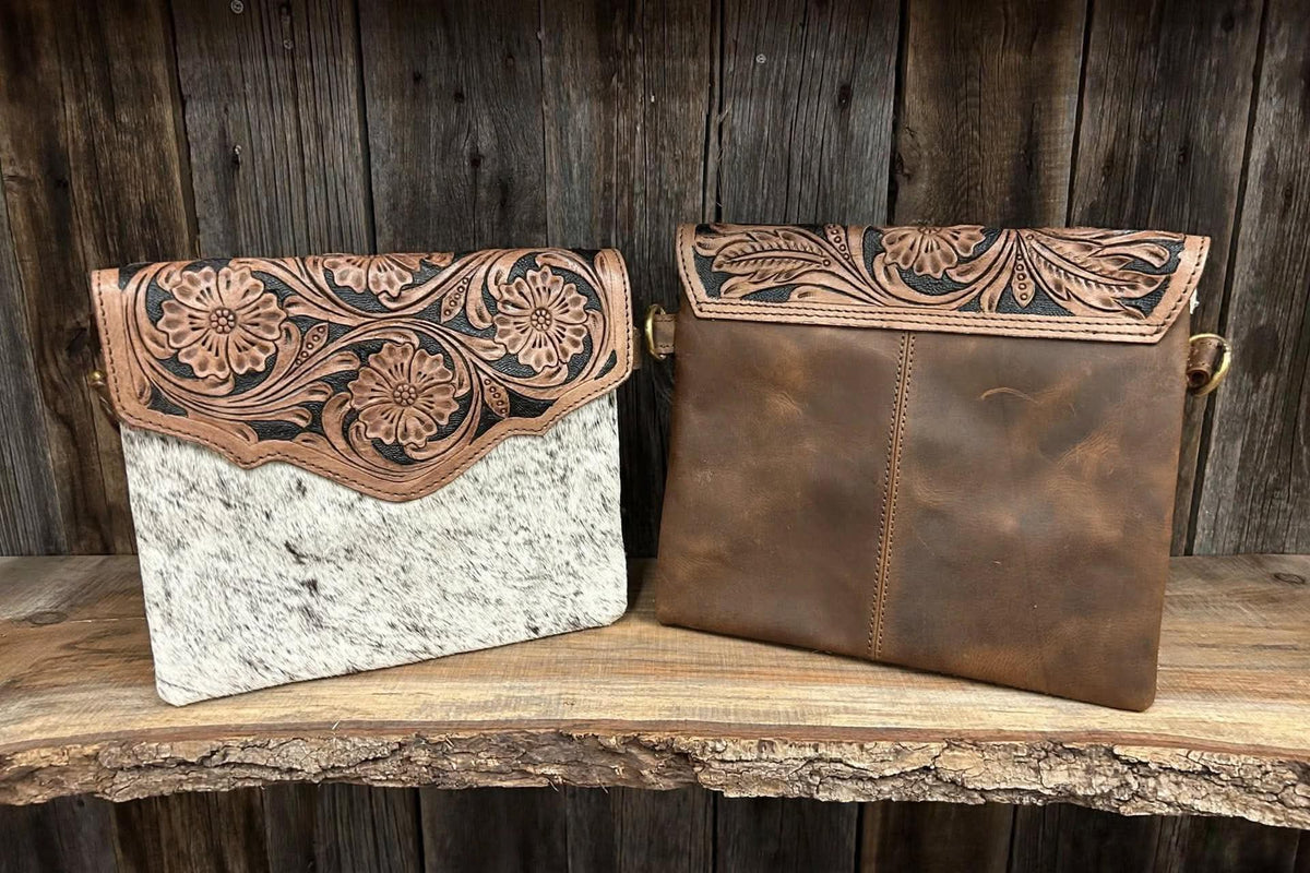 Leather purse with cowhide 9”L x 8”T adjustable shoulder strap included