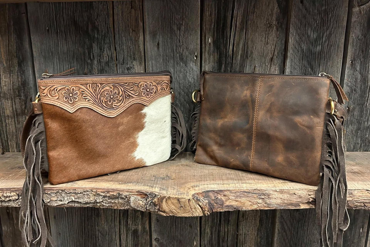 Leather purse with cowhide & fringe 10”L x 8”T adjustable shoulder strap included