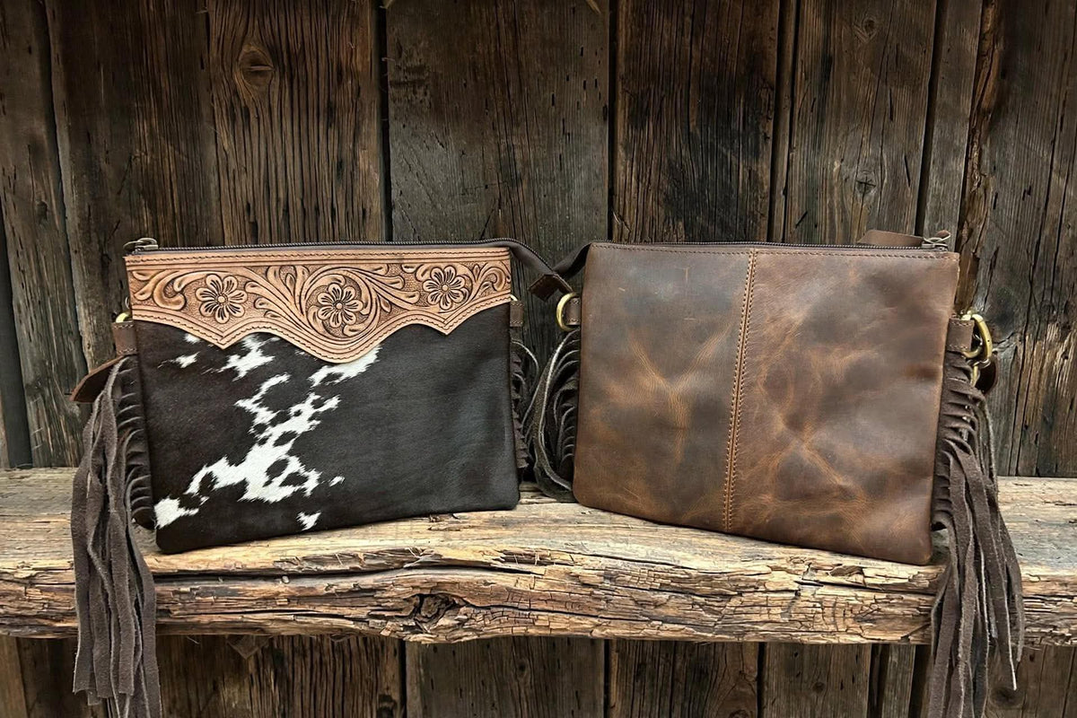 Leather purse with cowhide & fringe 10”L x 8”T adjustable shoulder strap included