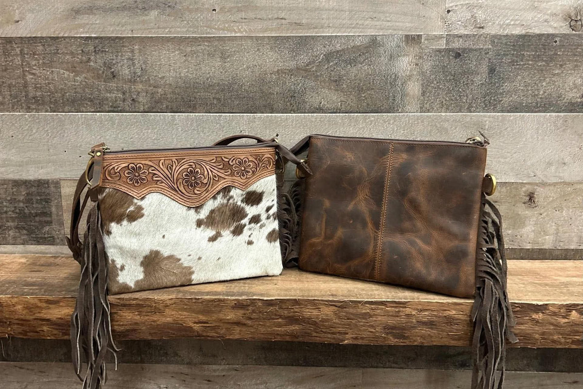 Leather purse with cowhide & fringe 10”L x 8”T adjustable shoulder strap included
