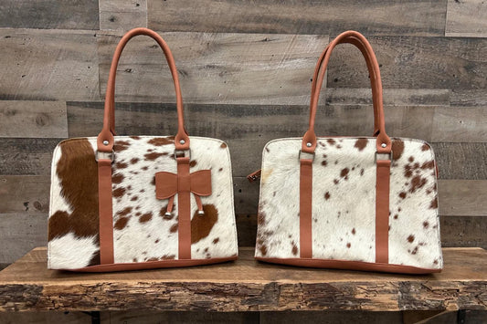 Leather purse with cowhide 14”L x 10”T 4” W adjustable shoulder strap included