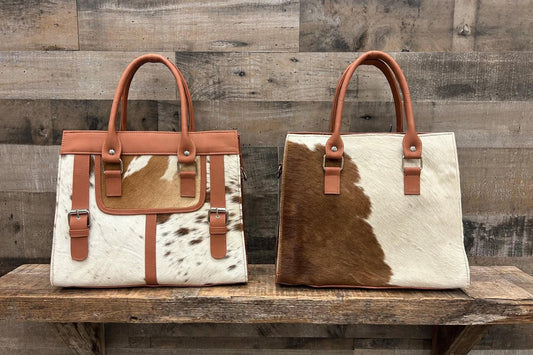 Leather purse with cowhide 14”L x 10”T 4” W adjustable shoulder strap included