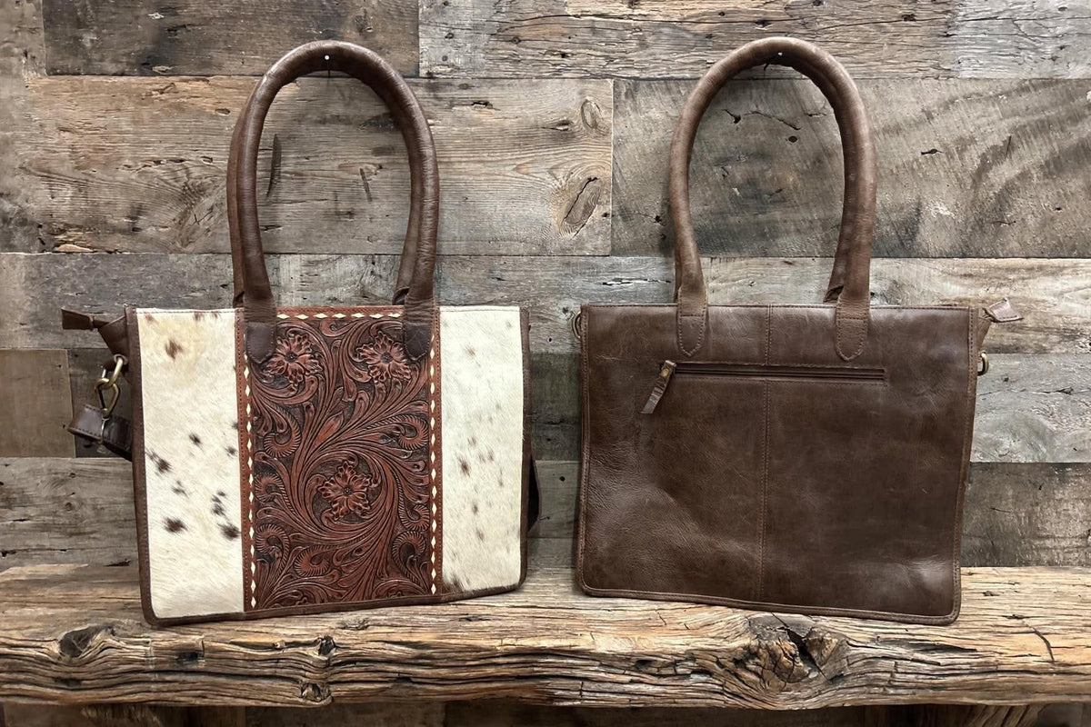 Leather purse with cowhide 14”L x 11”T x 3” W adjustable shoulder strap included